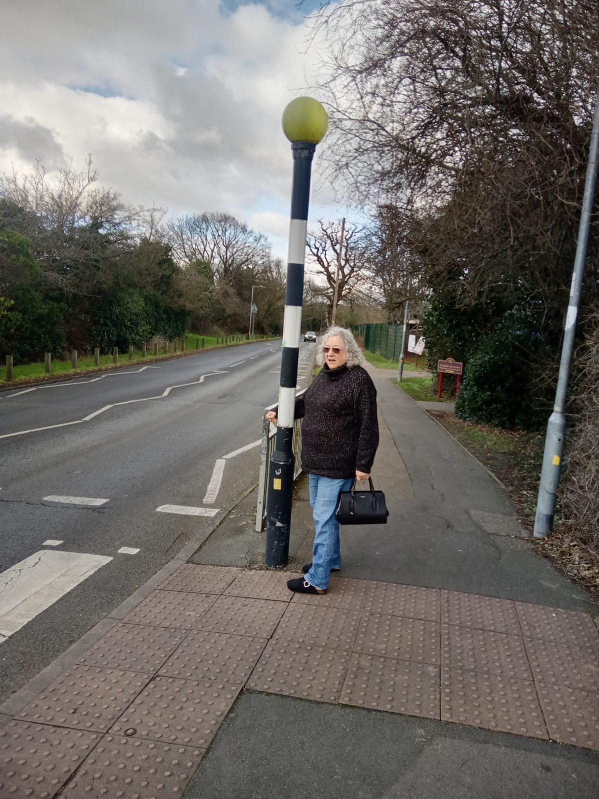 Concerned local resident at the crossing outside Perryfields School